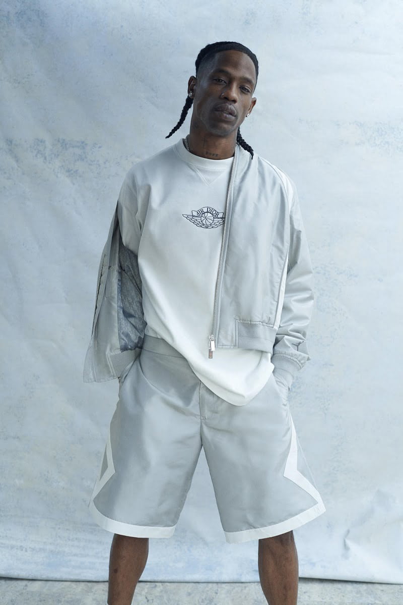 Travis Scott Wearing White Air Dior T-shirt With Air Dior MA1 Bomber and Silk Shorts In Post