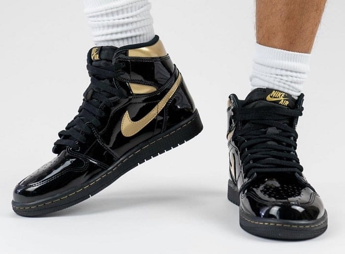 black and gold jordan ones