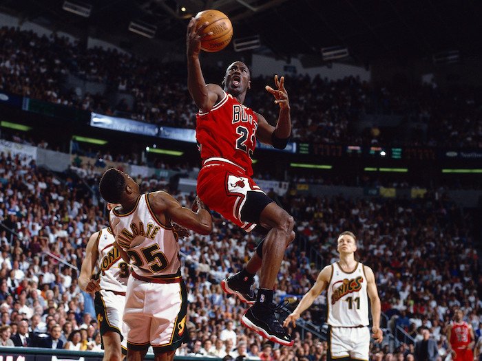 Michael Jordan wearing the Air Jordan 11 Bred