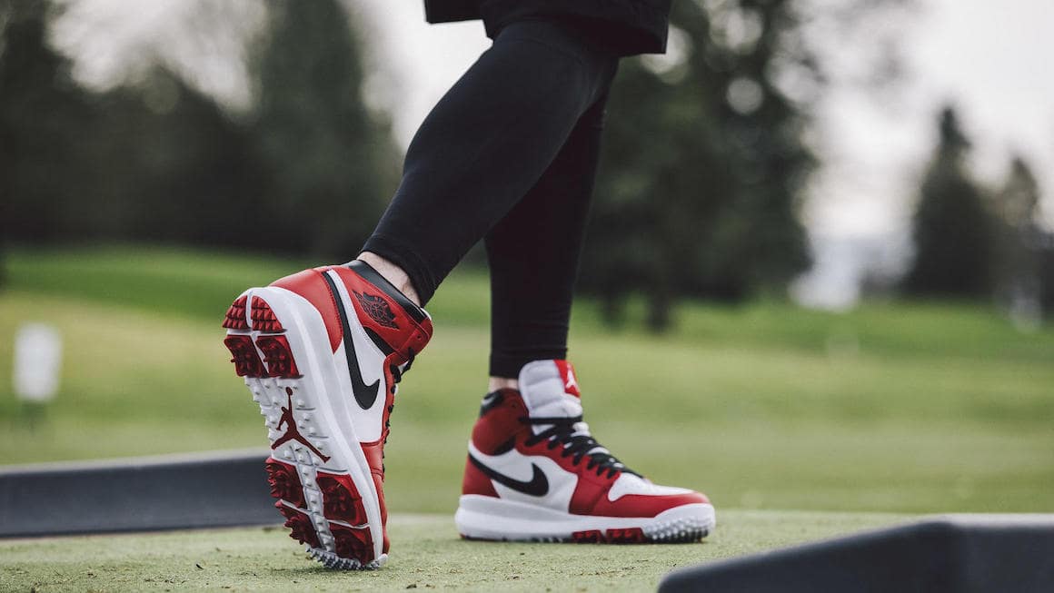 Air Jordan 11 Lows black and red converted to cleats